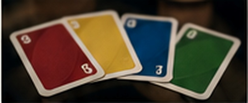Red, yellow, blue, and green playing cards